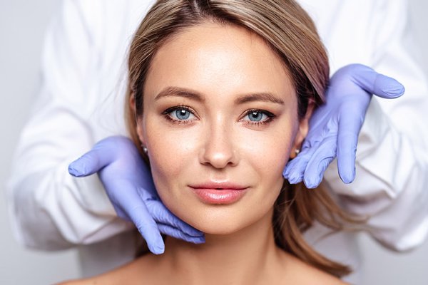 Woman's face in her late 50 with injectables and fillers treatments
