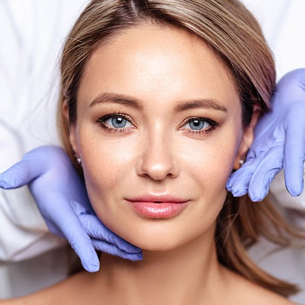Woman's face in her late 50 with injectables and fillers treatments